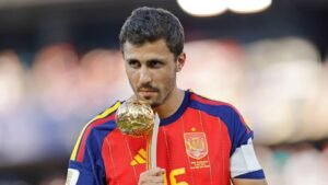 rodri-with-world-cup-golden-ball-trophy-1320x742